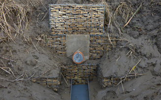 Gabions used to create an outlet into the river from waste water